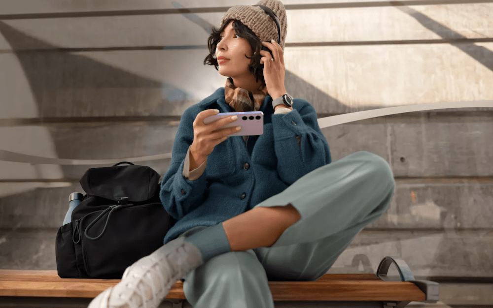 girl with cell phone and headphones